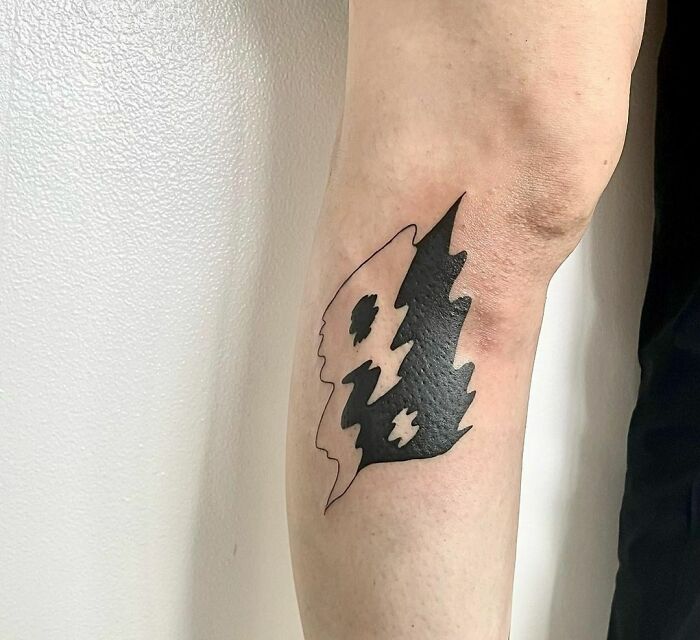 Blurred yin yang tattoo 