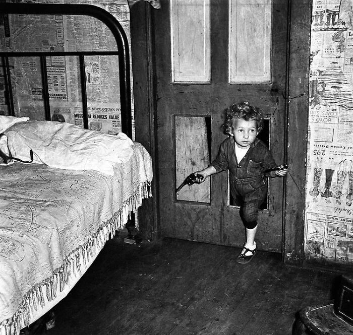 Coal Miner's Child Using A Hole In The Door To Enter A Bedroom ,1938