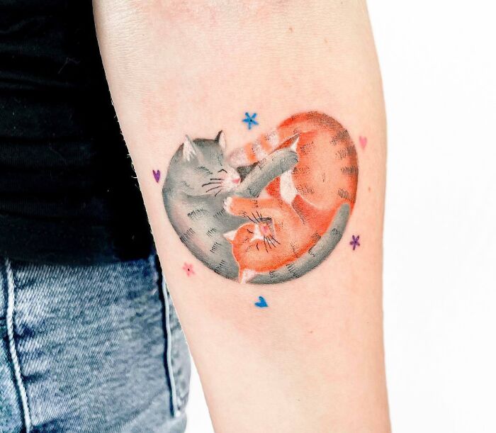 Grey and orange cats tattoo