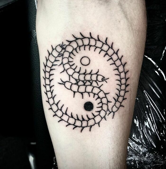 Yin yang centipede arm tattoo 
