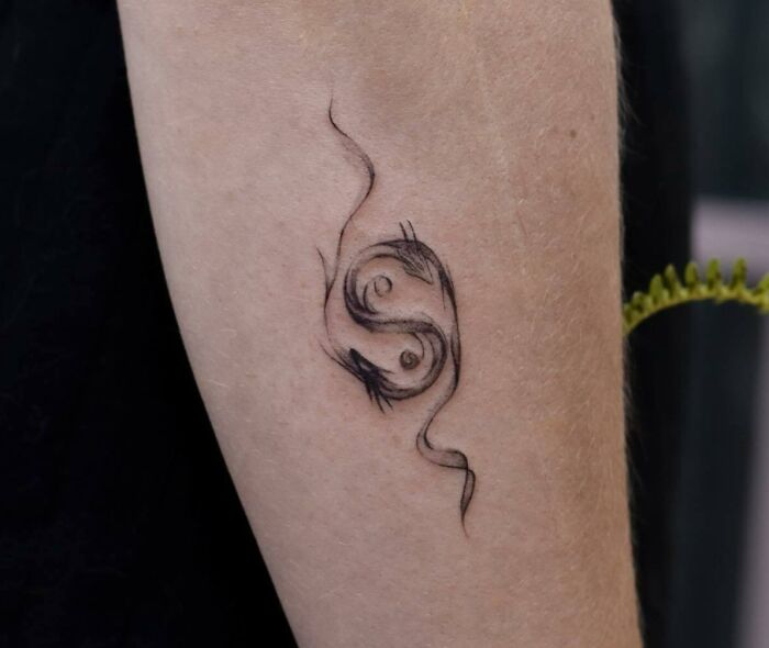 Dragons yin yang forearm tattoo 