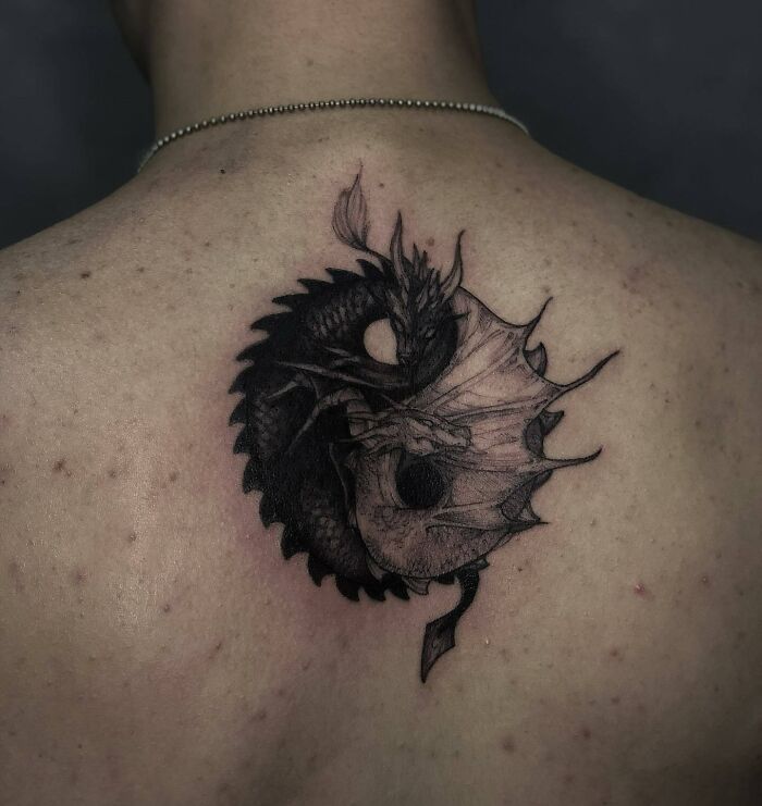Yin yang of two dragons spine tattoo