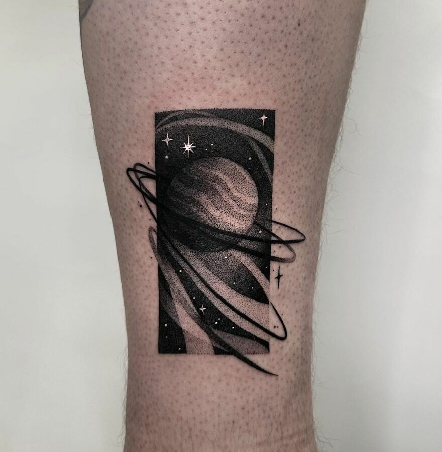 Unique Saturn in space tattoo