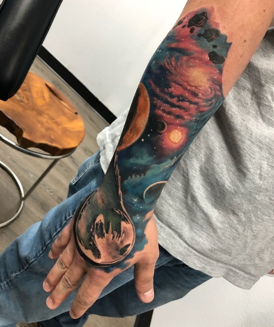 Half of space arm sleeve tattoo