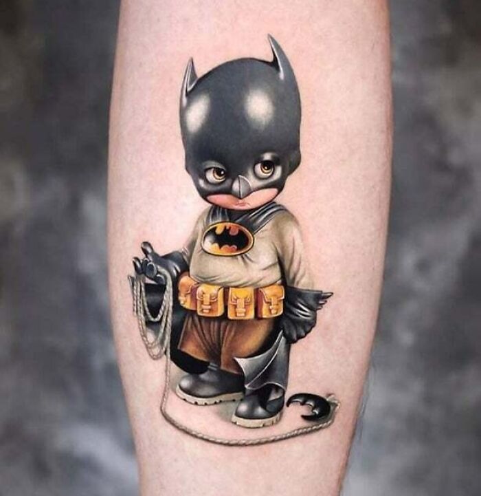 Realistic young Batman tattoo
