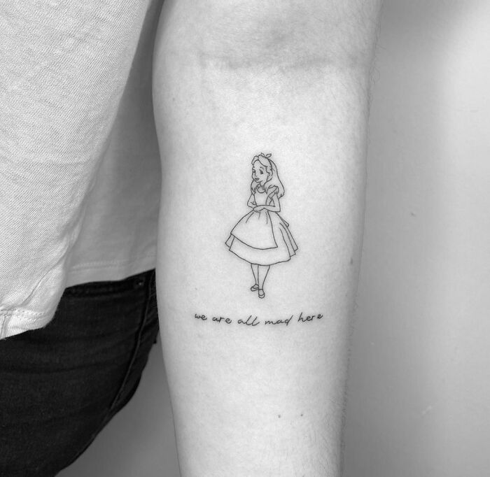 Fine line Alice In Wonderland forearm tattoo