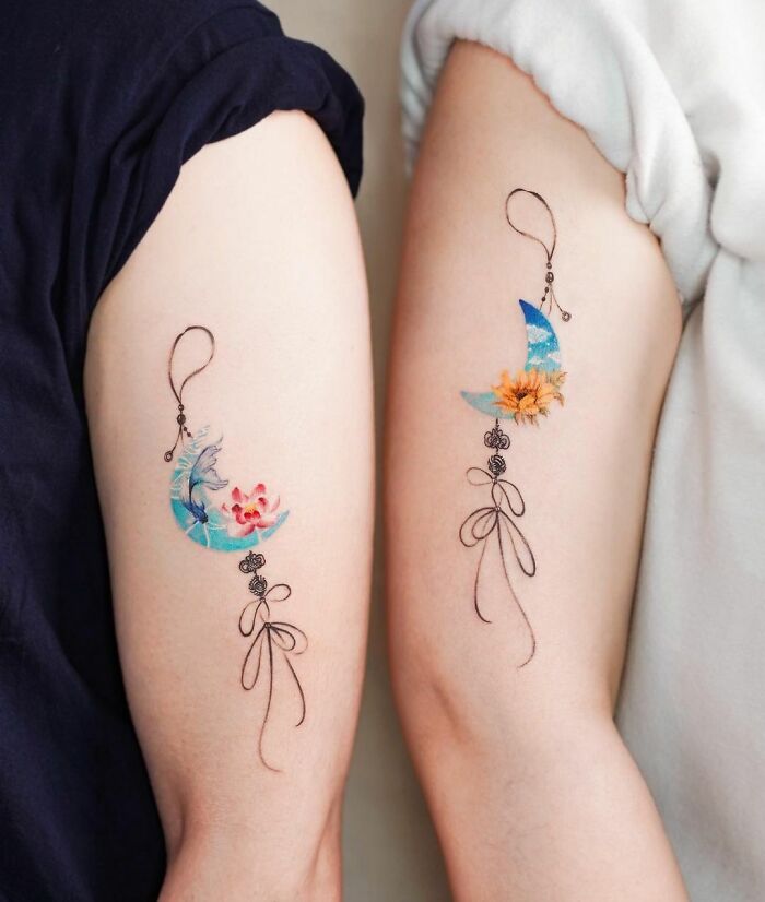 Matching 'Norigae' arm tattoos