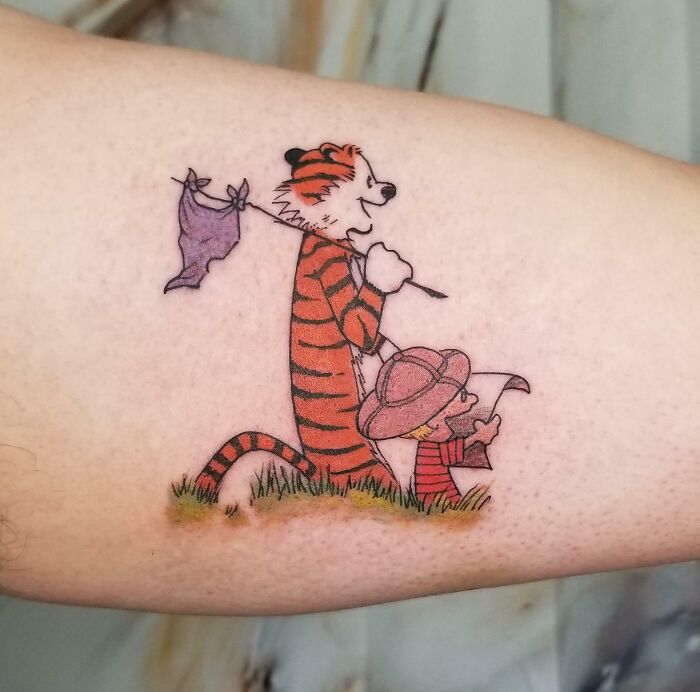 Calvin and Hobbes arm tattoo