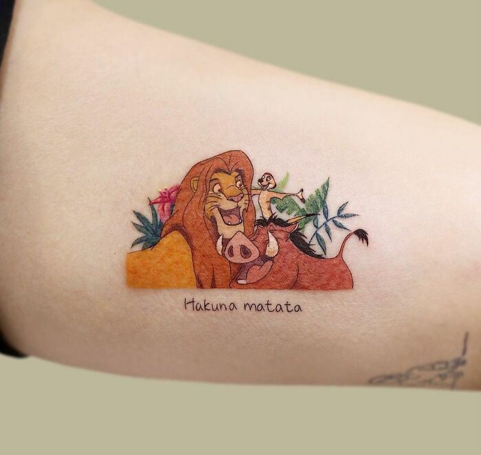 Timon, Pumbaa and Simba arm tattoo