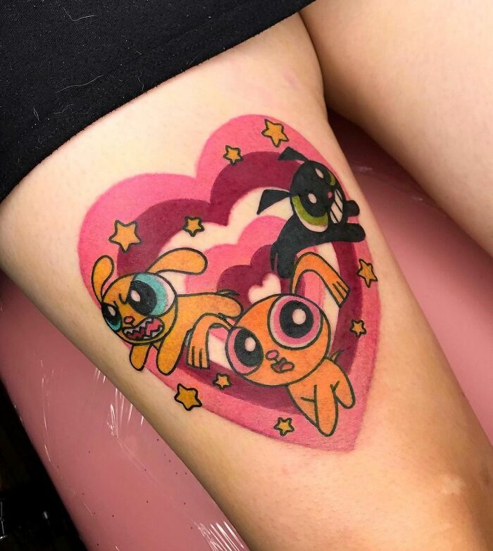 The Powerpuff Girls as dogs in a heart tattoo