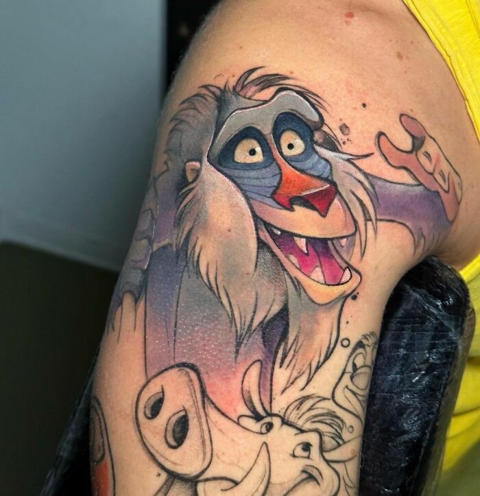 Colorful Rafiki from The Lion King tattoo
