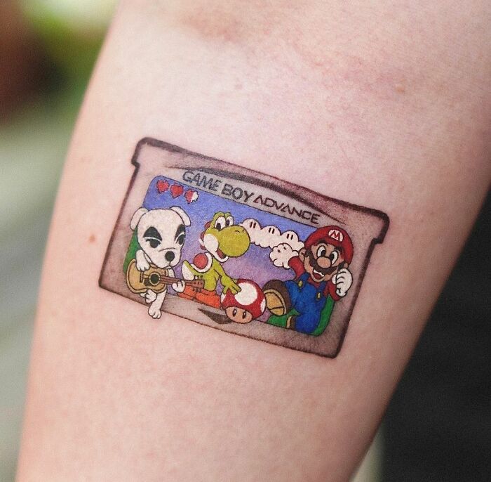 Game Boy Advance with game characters tattoo 