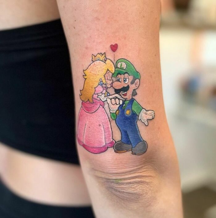 Peach and Luigi arm tattoo