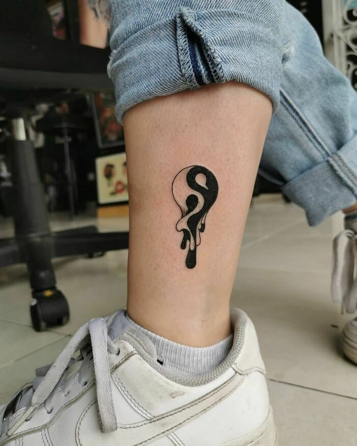 Yin Yang melting symbol tattoo 