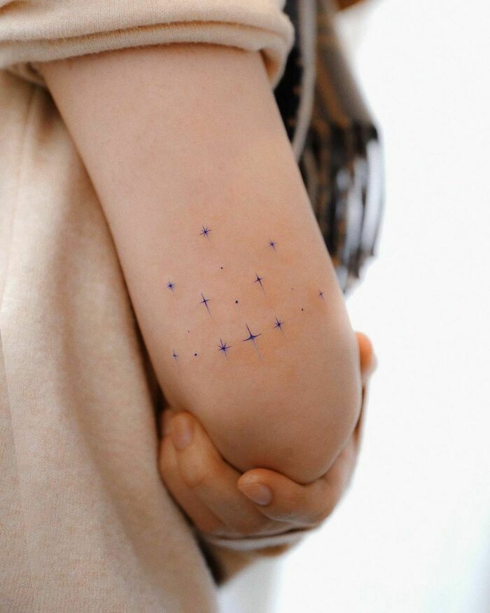 Stars elbow tattoo