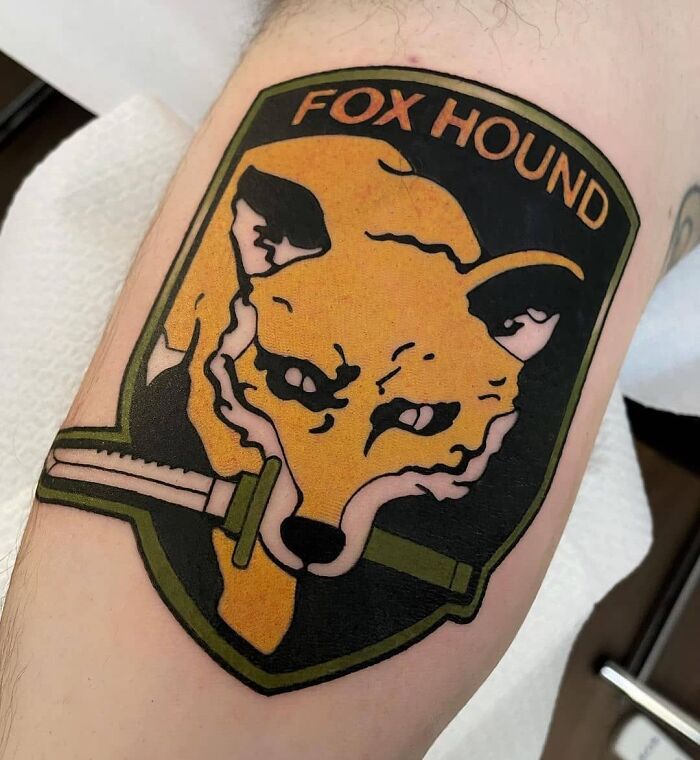 Fox holding a knife tattoo 