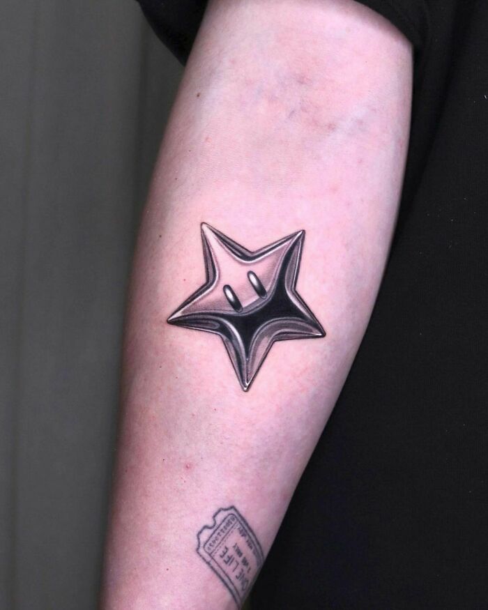Chrome Mario Star Hand Tattoo