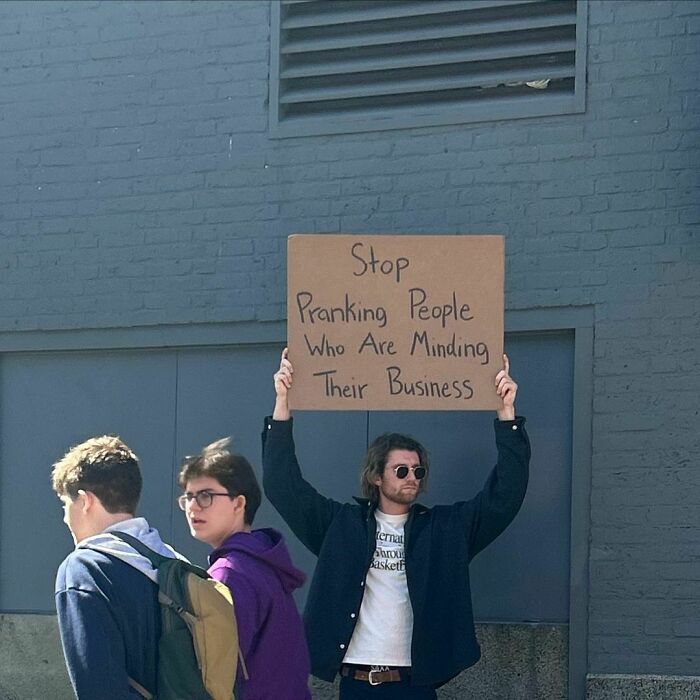 Clever-Dude-With-Sign-Protesting-Annoying-Things