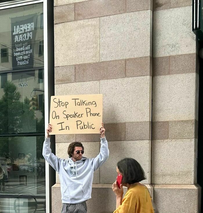 Clever-Dude-With-Sign-Protesting-Annoying-Things