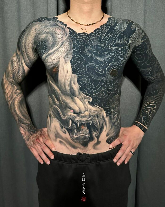 White and black yin yang dragon torso tattoo 