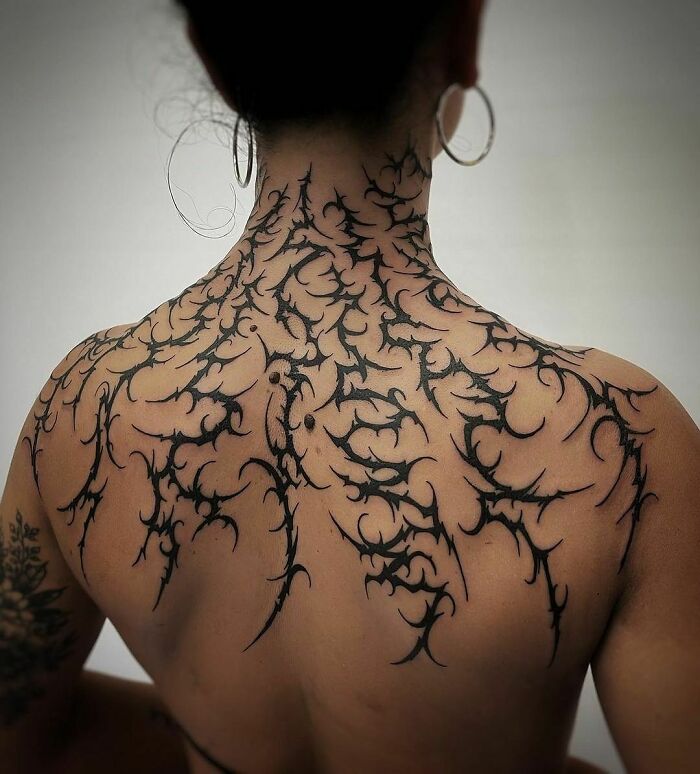 Back and neck Tribal Tattoo