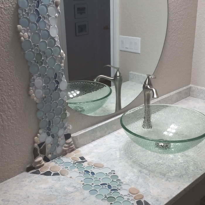 Concrete bathroom with embedded pebbles and glass fragments