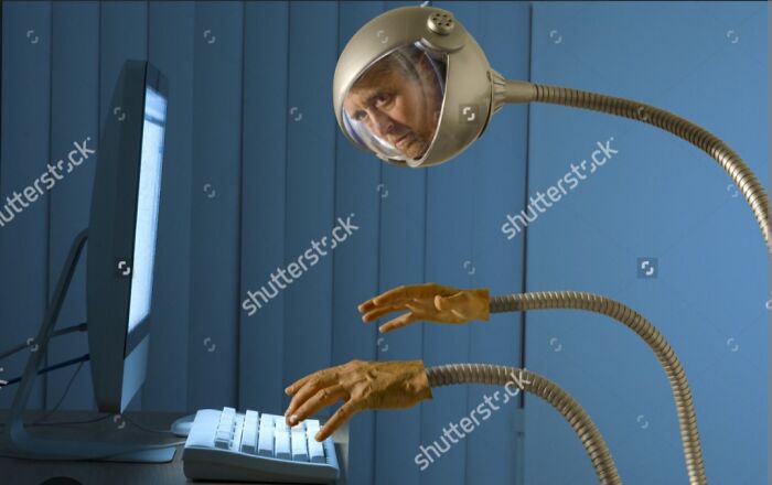Futuristic Showerhead Man Tries To Figure Out How Computers Work