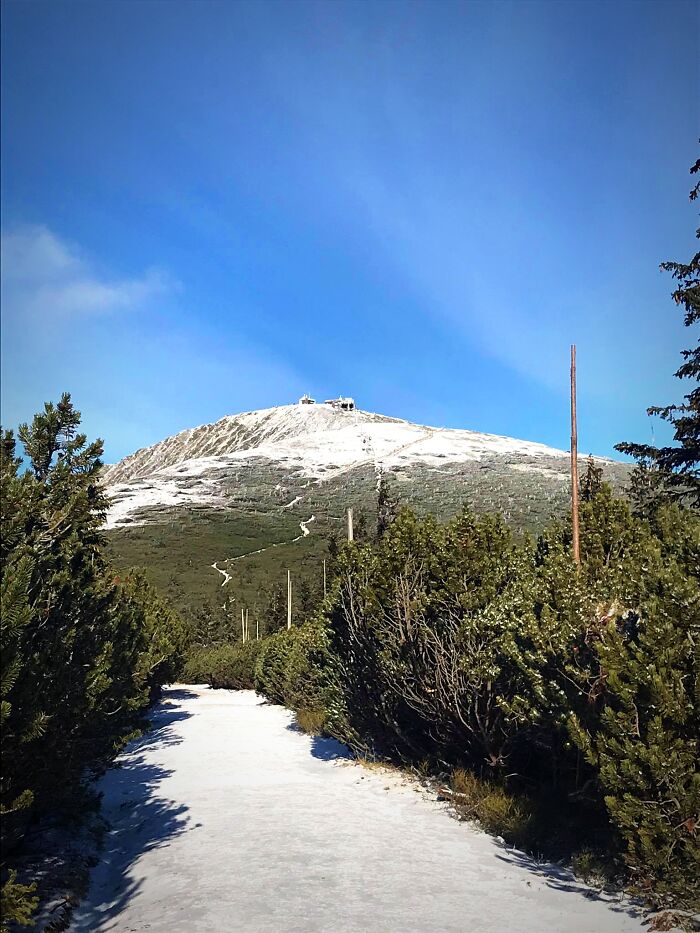 A Pathway To A Snow-Covered Summit