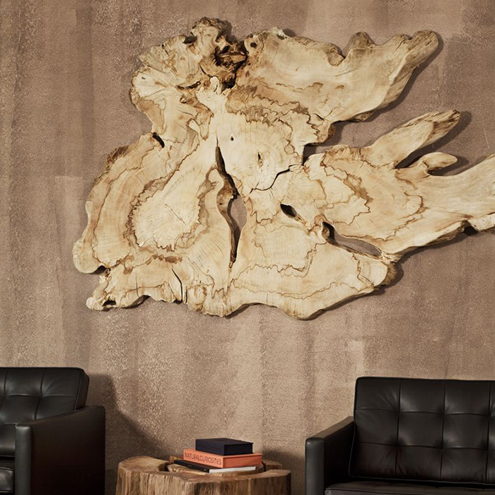 Large raw live edge wood wall hanging in workroom