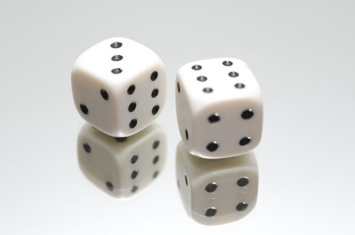 Pair of white dice on top of the mirror
