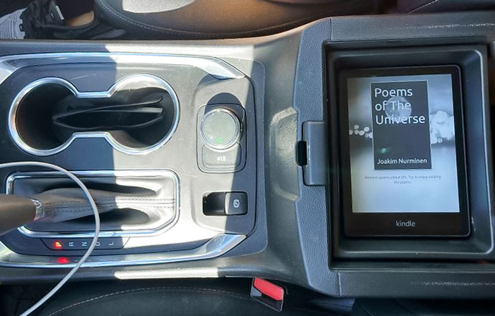 Console Compartment Fits My Kindle Perfectly
