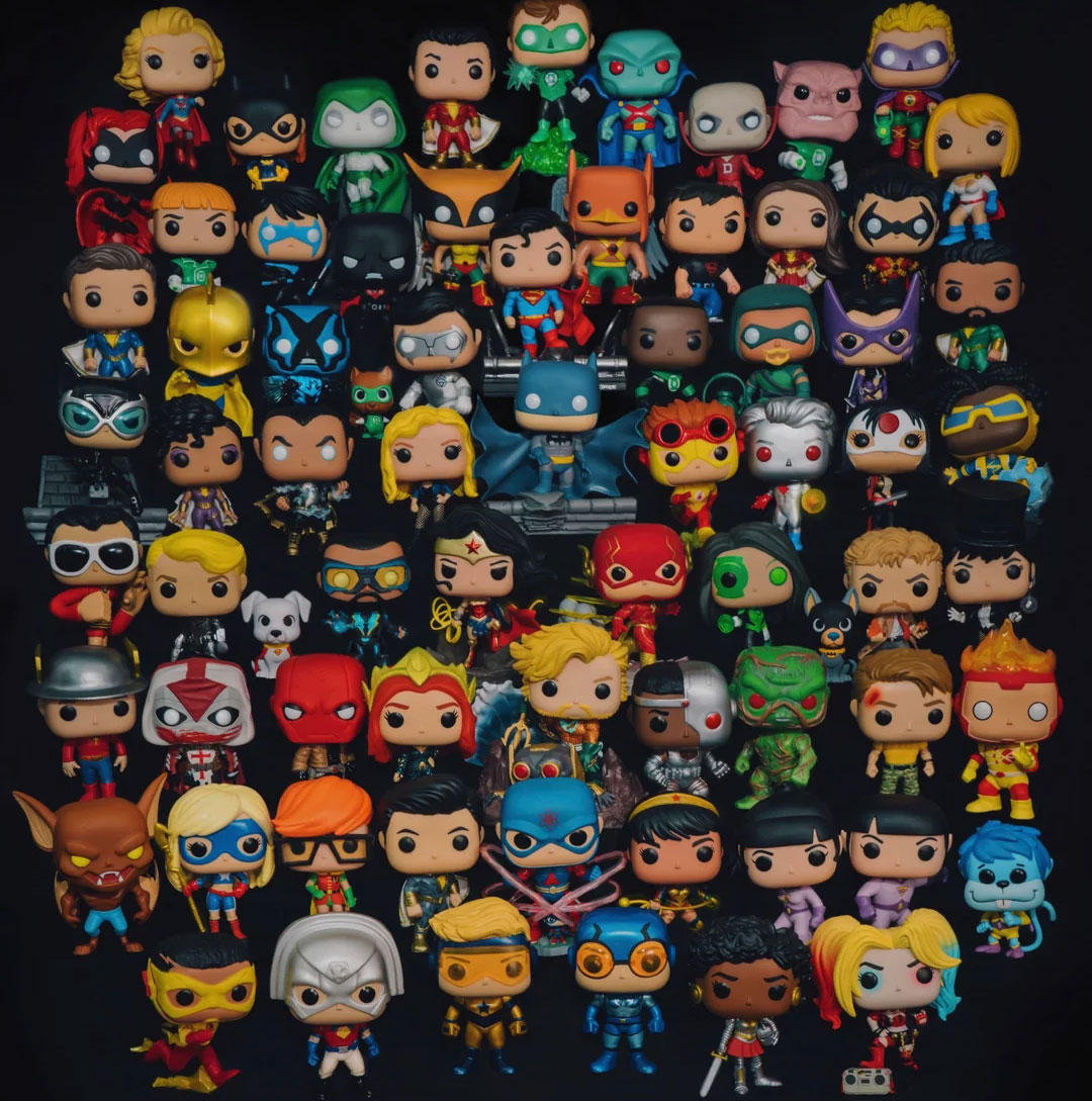 a lot of funko pops in a black background