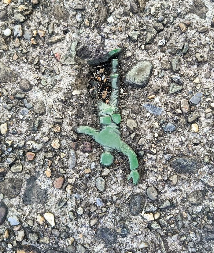Today On My Walk I Found An "Army Man" Embedded In The Sidewalk
