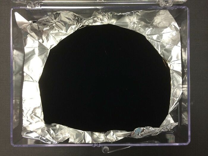 Vantablack on aluminum foil, showing its property of removing visual texture from objects