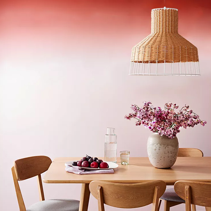 White and red ombre gradient wall inside dining room
