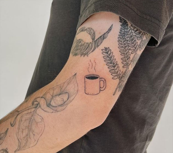 Hot coffe mug elbow tattoo