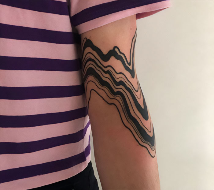 Tri[[y elbow tattoo