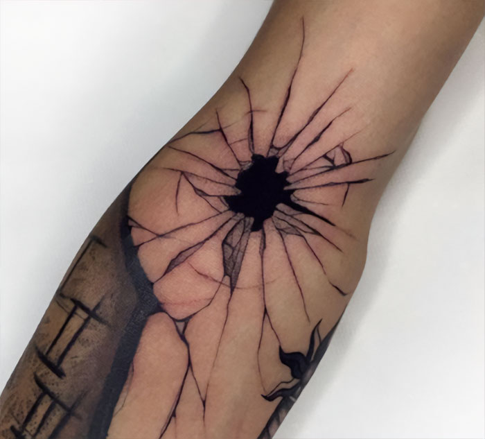 Broken glass imitation elbow tattoo