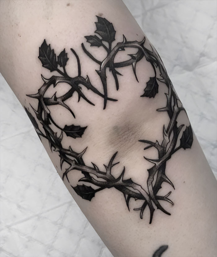 Heart from branches elbow tattoo