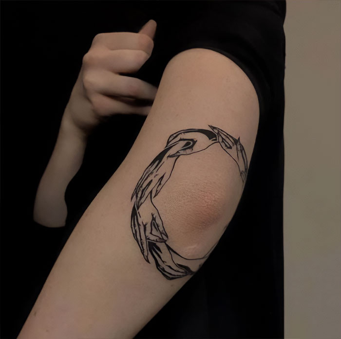 Witch hands elbow tattoo