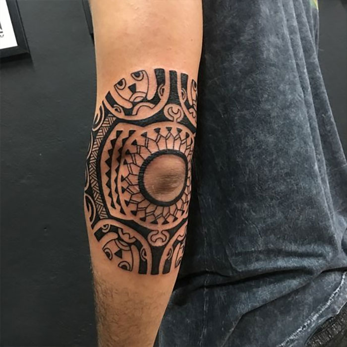 Ornamental elbow tattoo