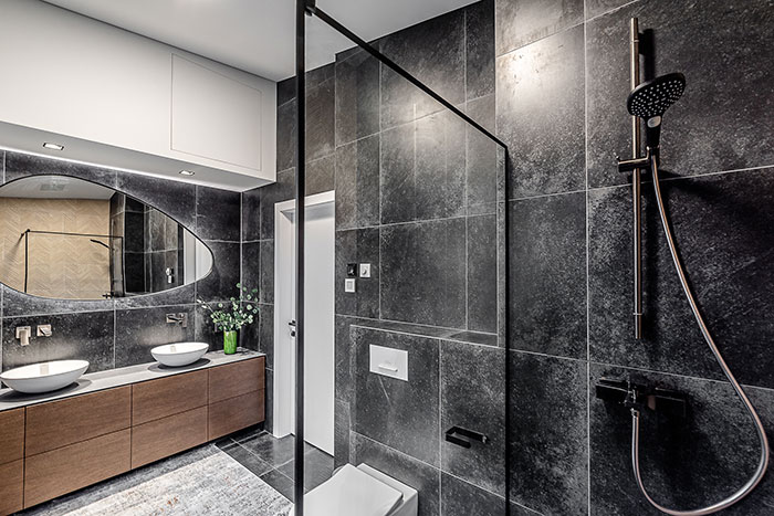 Distinctive Shape Mirror In A Modern Bathroom Distinctive Shape Mirror In A Modern Bathroom