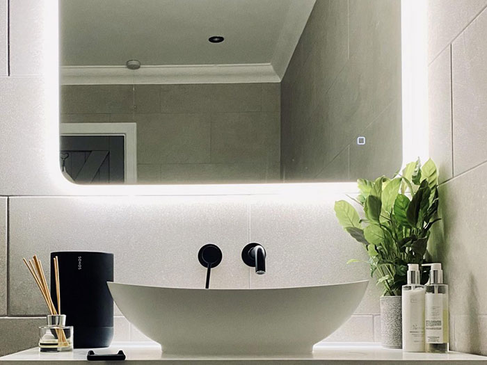 Black Speaker Next To A Bathroom Sink