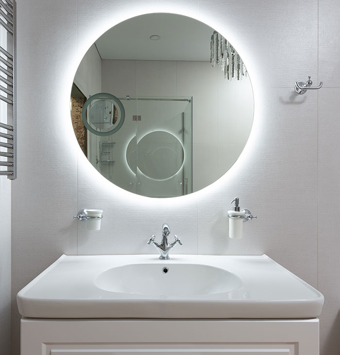 White Bathroom With Integrated Lights Behind A Mirror 
