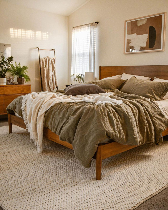 Cozy and bright bedroom with soft-colored linen bedding