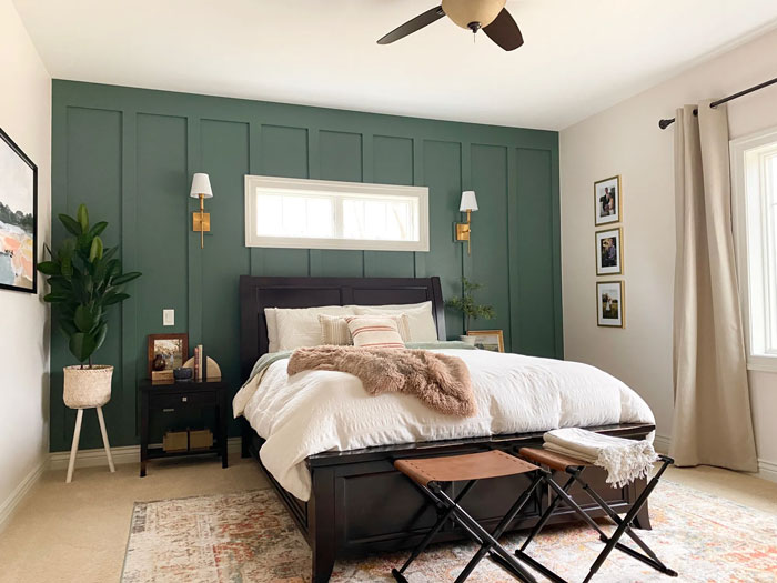 Green accented wall in white wall bedroom