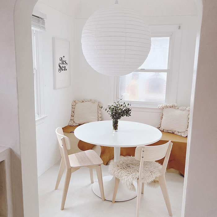 White breakfast nook near a window White breakfast nook near a window