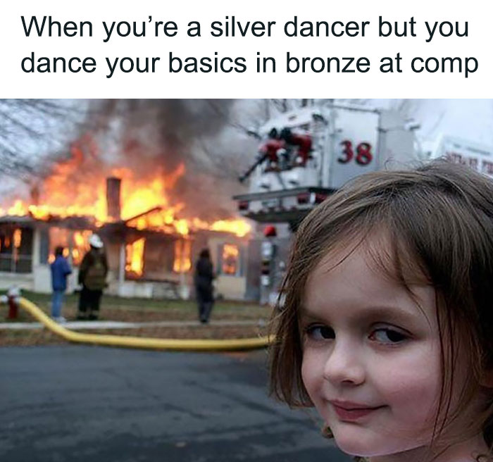 Silver dancer meme: girl smirking with house on fire in background, captioned about dancing bronze basics in competition.