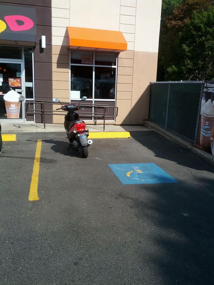 This Woman Parked Her Scooter In A Handicapped Spot To Get Dunkin Donuts, Then Drove Away With Her Son Sitting On Her Lap. Unbelievable