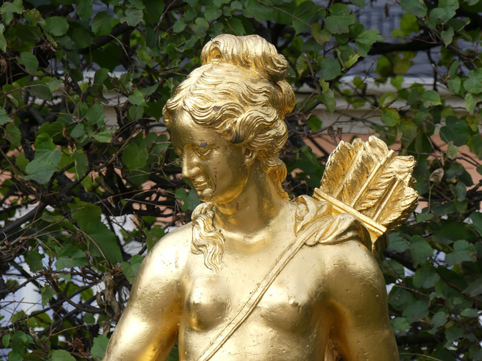 golden sculpture of the goddess Artemis